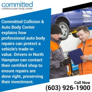 Auto body repair professionals assisting clients.