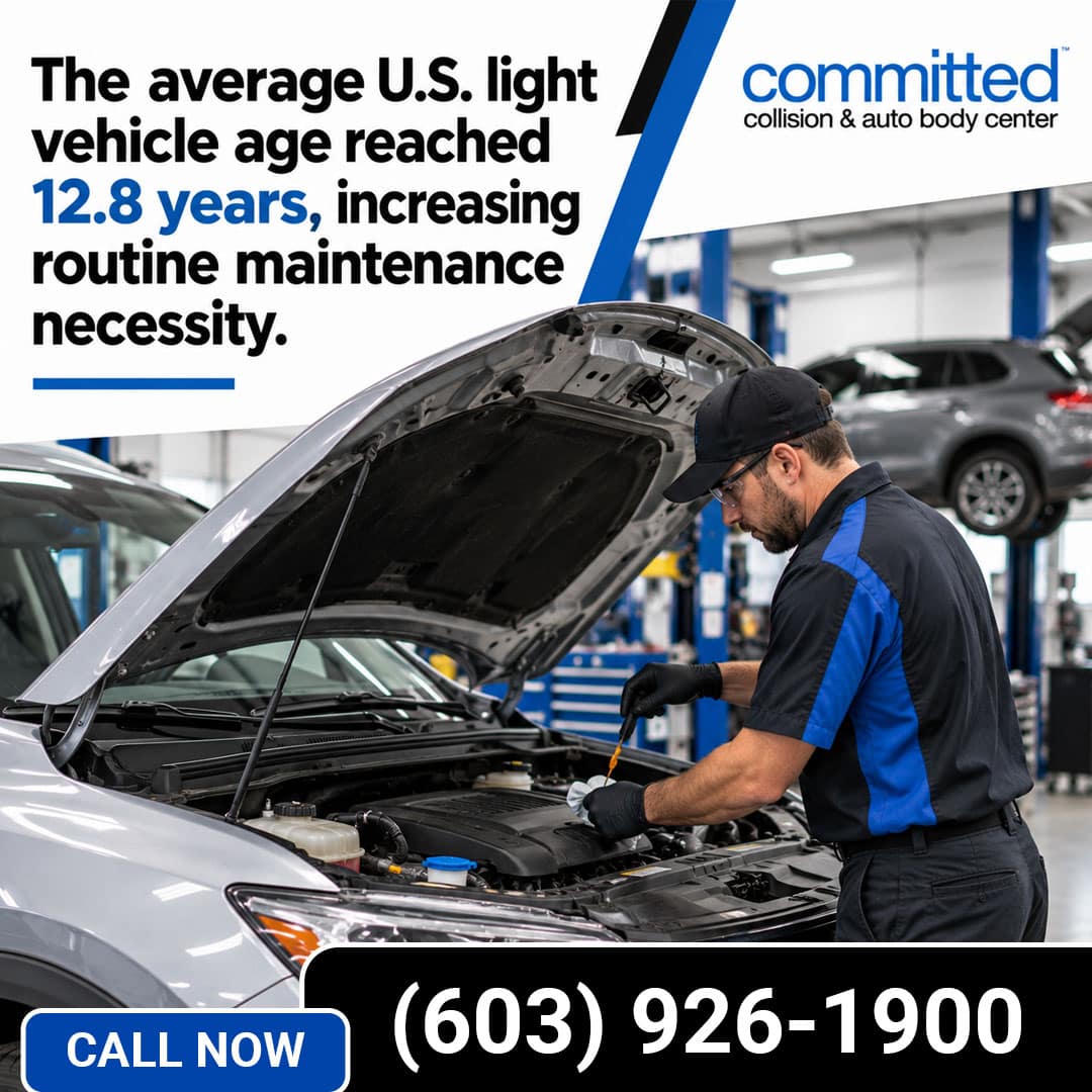 What Routine Services Does General Auto Repair Include? 1 Automotive technician checking an engine oil dipstick with a cloth under the open hood of a car inside a repair shop bay.